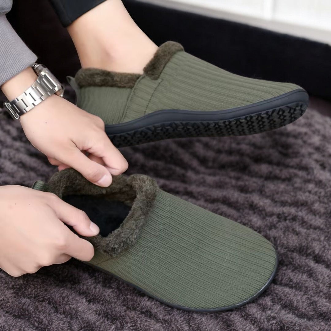 green slippers with black barefoot sole