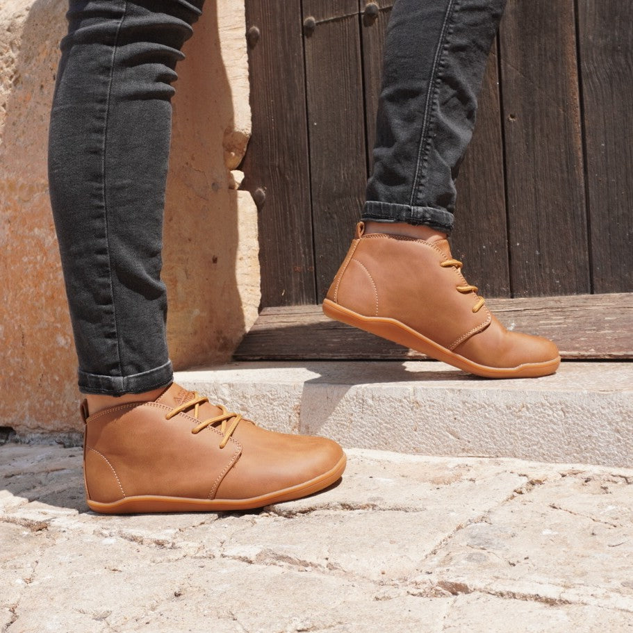 tabacco smart casual barefoot shoes on sunny environment with black jeans man on pavement