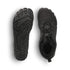 Black boots with detailed sole design on a white background