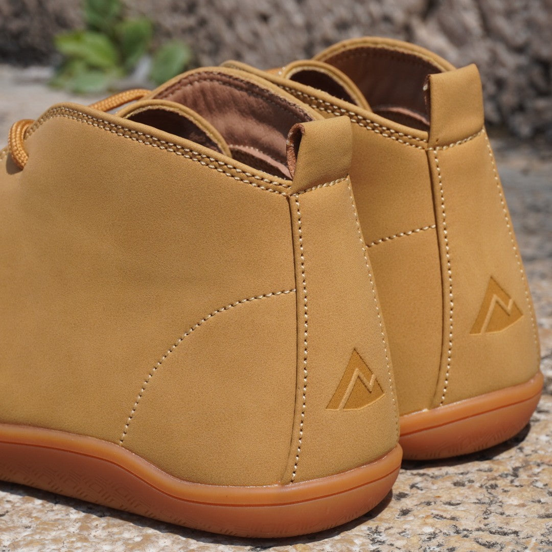 Smart barefoot shoes with a logo on a textured surface