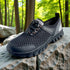 detail of black hiking trekking barefoot shoes in the nature