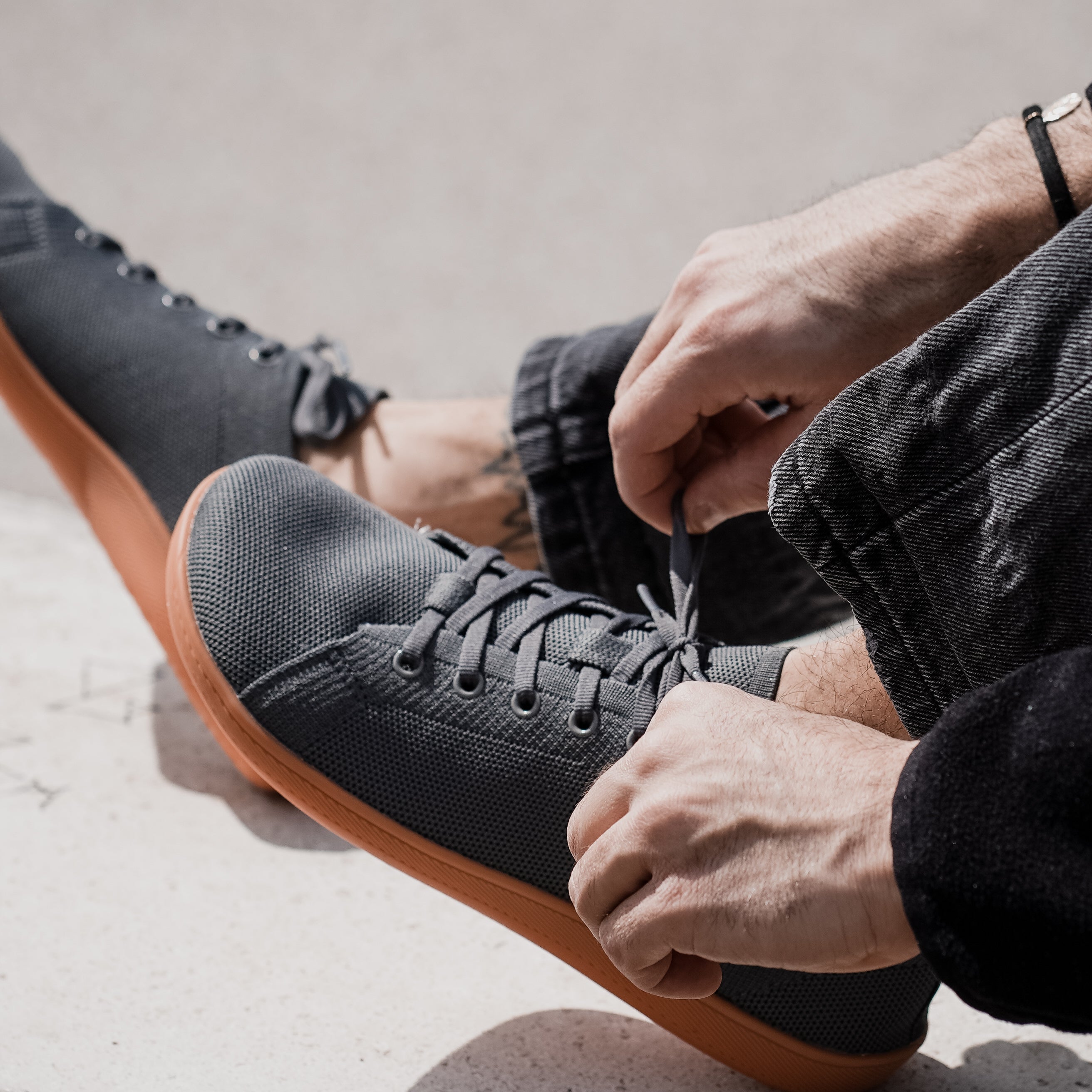 grey urban breeze 2.0 barefoot shoes laces on a wall