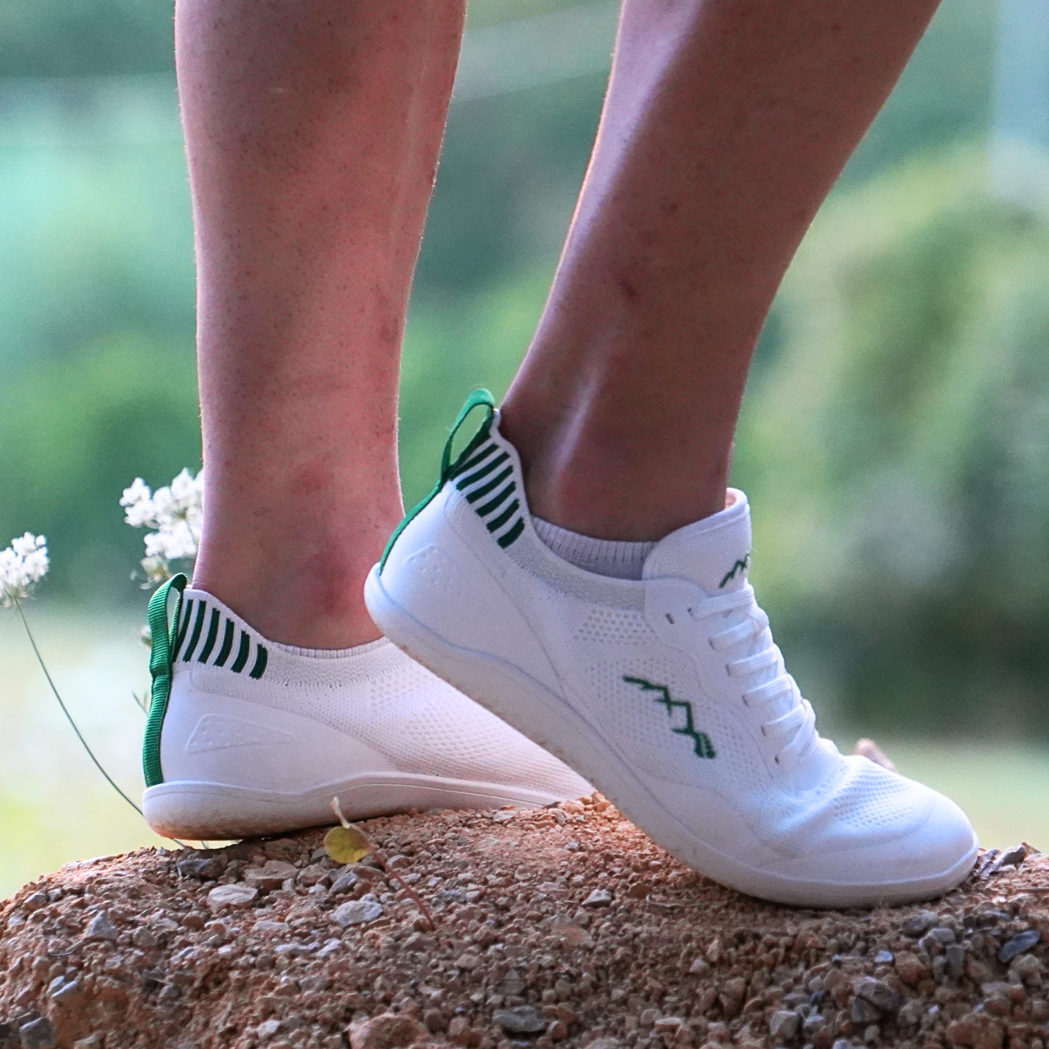 worn summer barefoot shoes white on gravel in spring