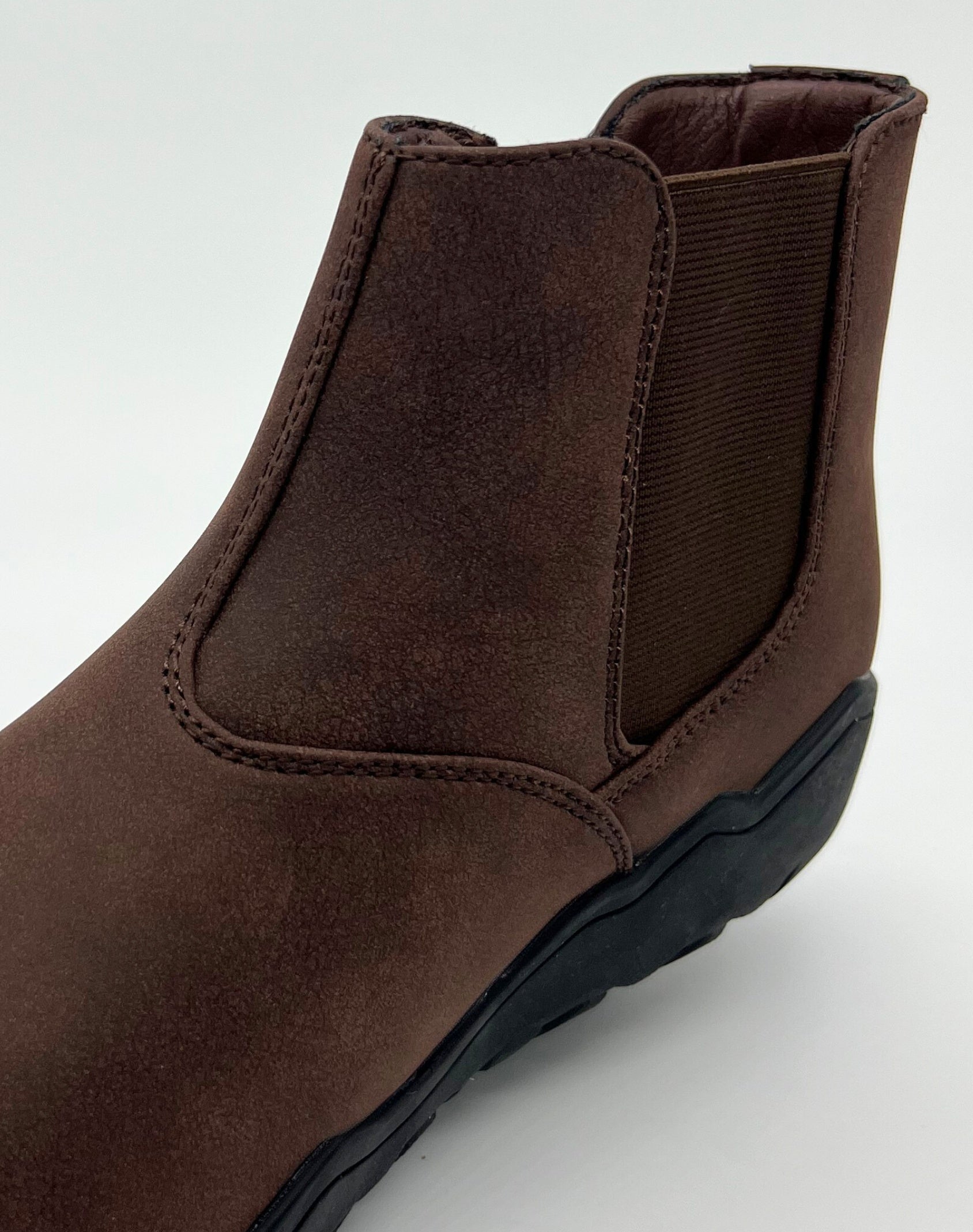 Brown ankle boot on a white background
