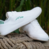 white barefoot shoes on a rope in nature side view