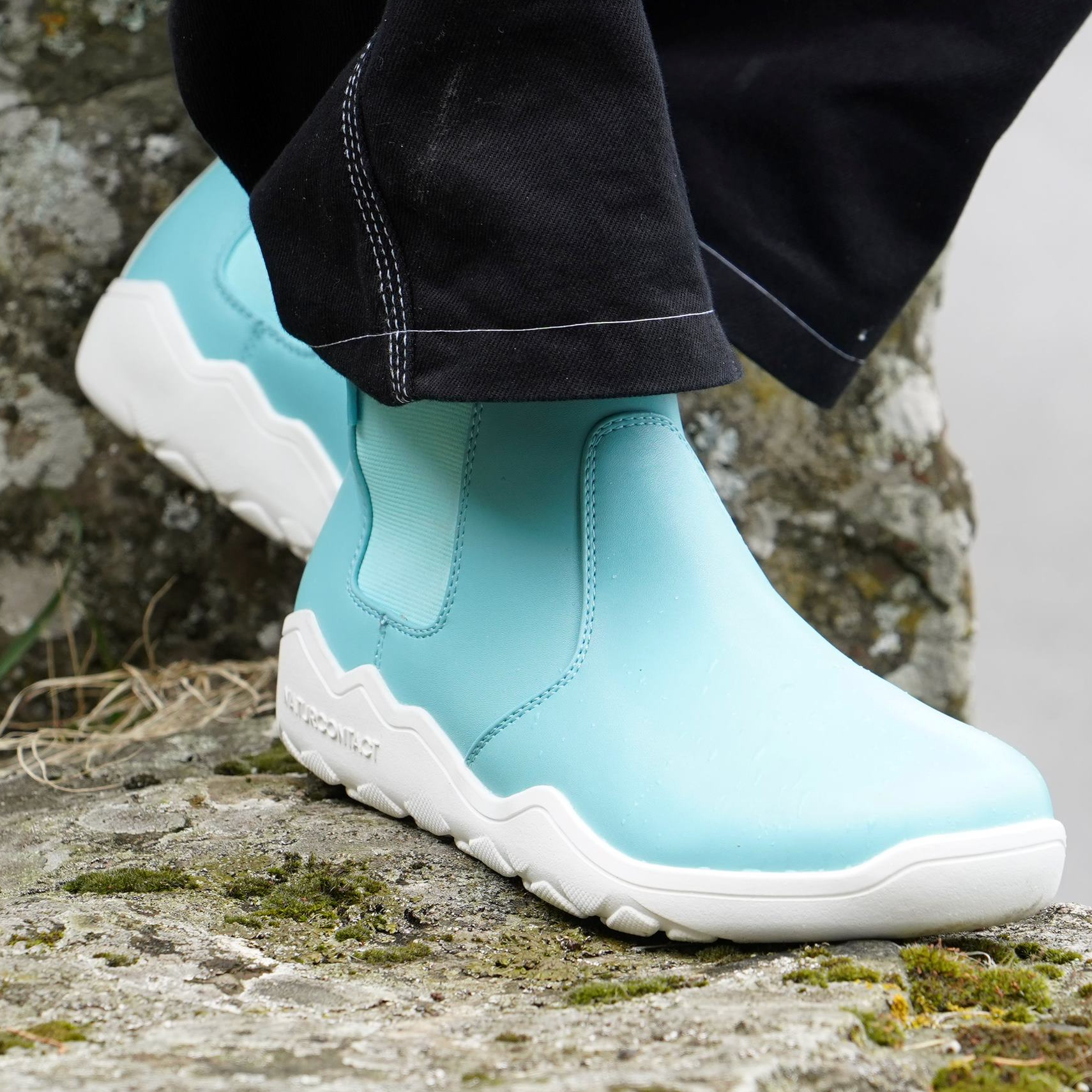 front view of light blue barefoot boots chelsea on a rick