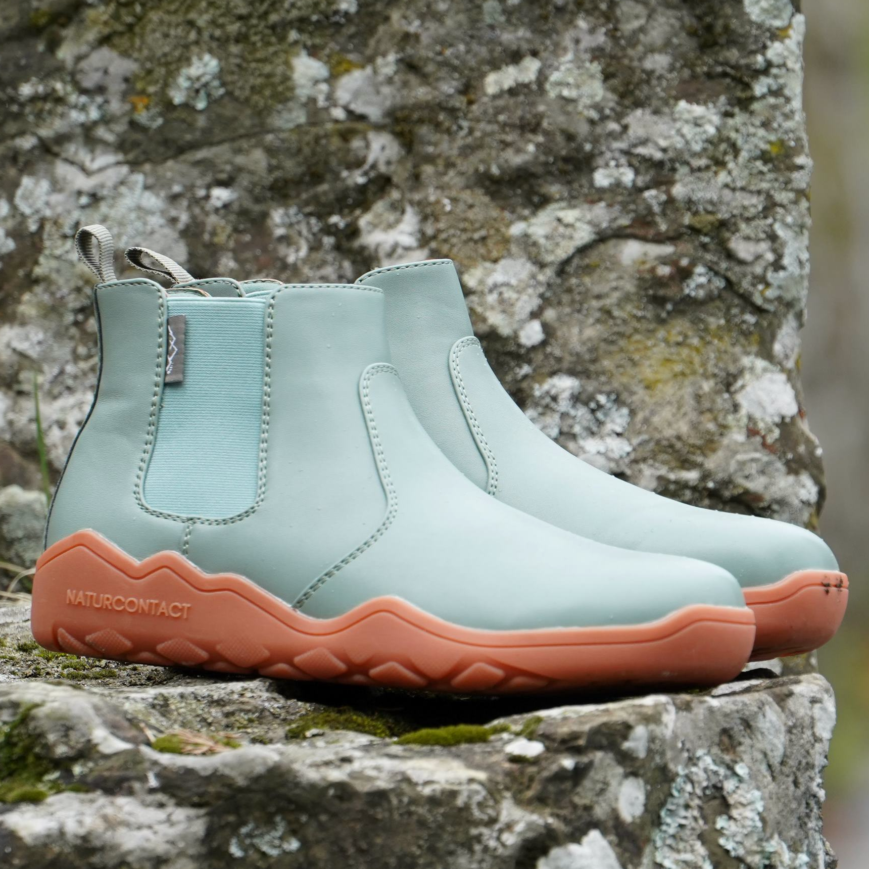 side view of green barefoot chelsea boots