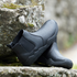 black chelsea barefoot boots on a rock