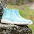 side view of light blue barefoot chelsea boots with white sole