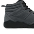 Grey winter barefoot shoe with black laces on a white background, close-up side view.
