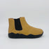 video of Yellow Chelsea boot with black sole on a white background