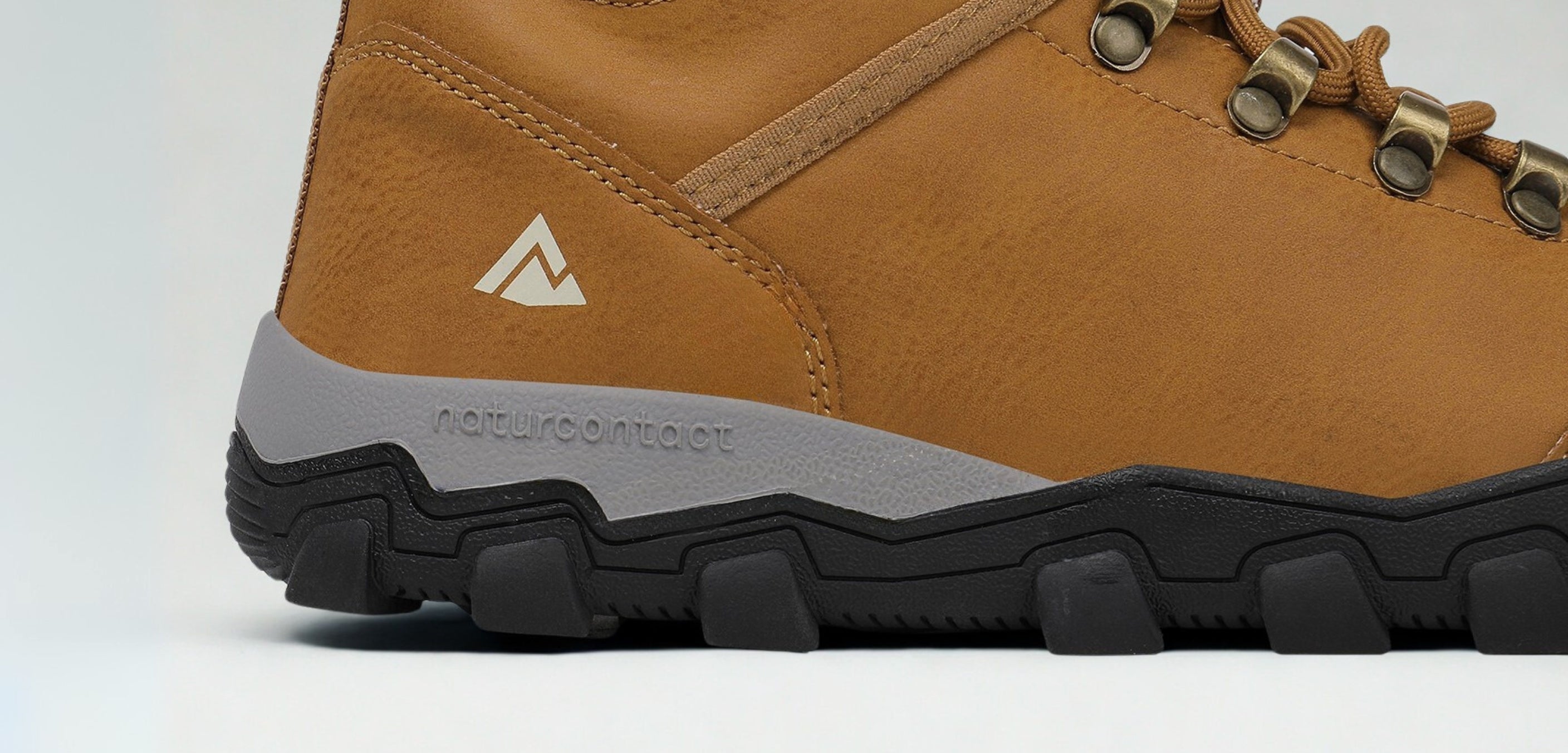 Brown hiking boot with brand logo on a light gray background