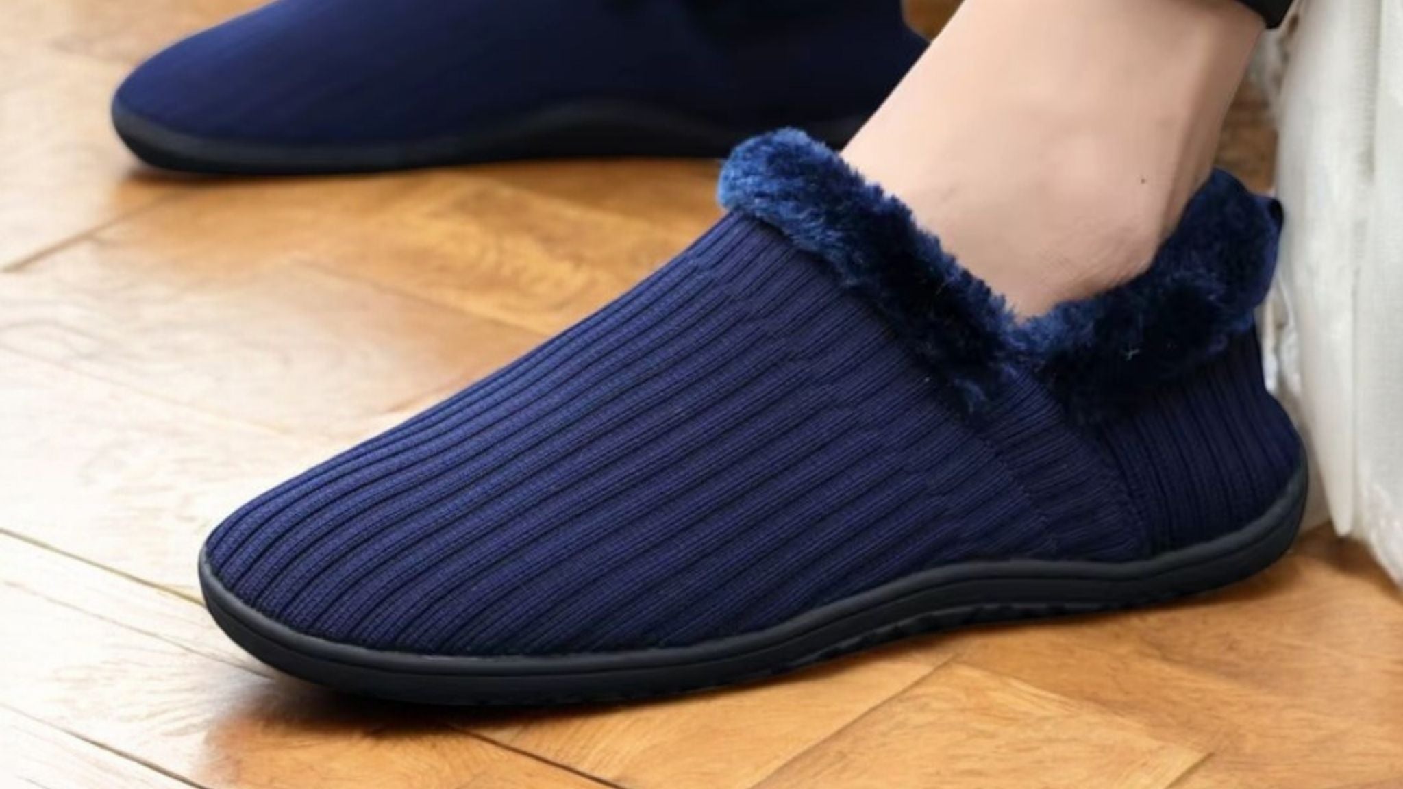 Close-up of barefoot-style home slippers with soft lining and flexible sole