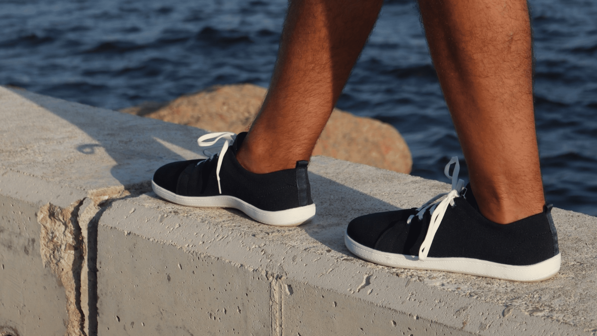 Person walking in barefoot shoes, showing why barefoot shoes are good for flat feet