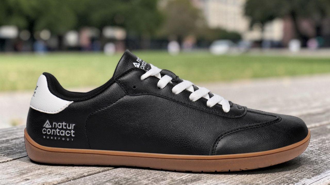 Black minimalist barefoot shoe showing natural wide toe box design explaining are barefoot shoes good for your feet