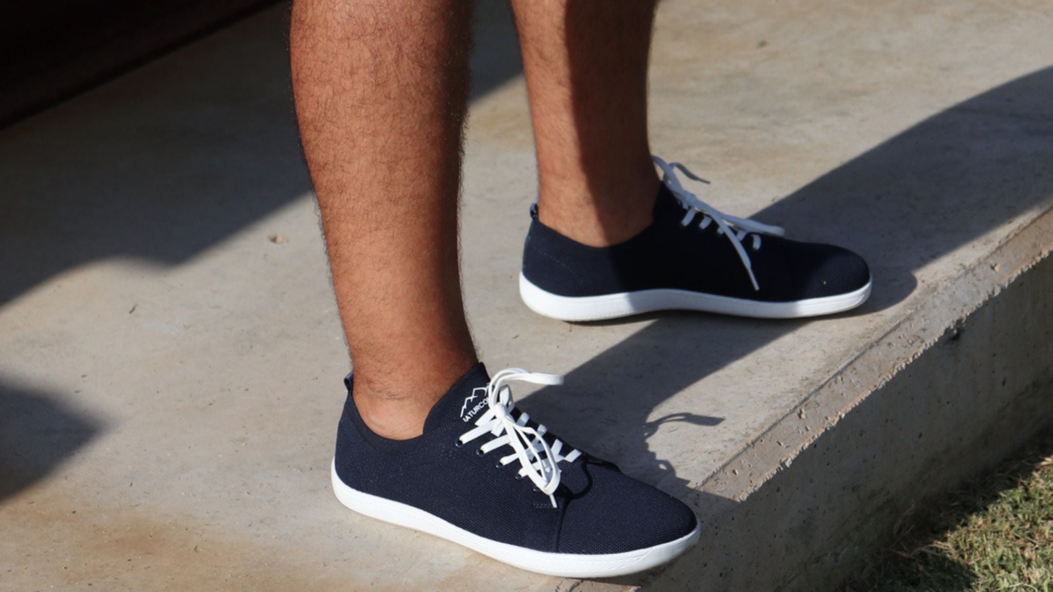 Side view of barefoot shoes with cushion showing flexible sole and wide toe box