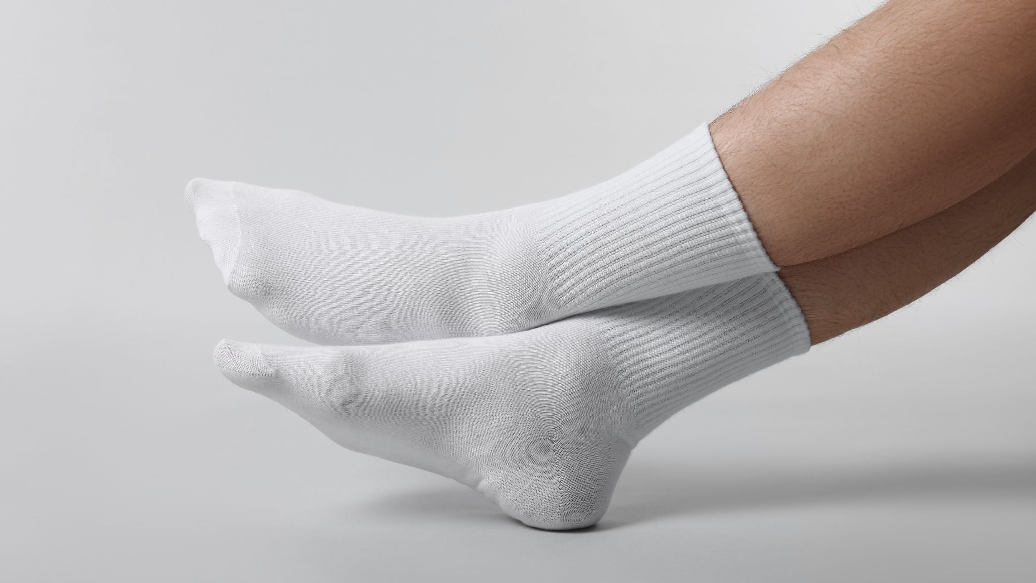 Person trying barefoot shoes and asking: 'Do you wear socks with barefoot shoes?'