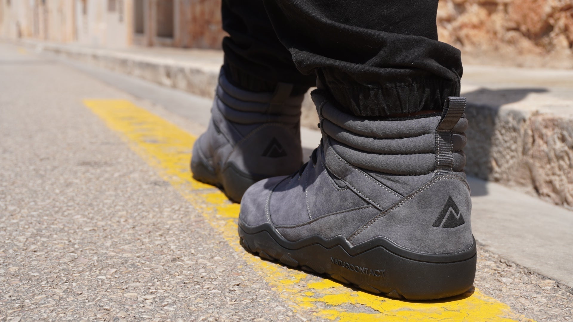 Minimalist barefoot boots used for slow, mindful walking during adaptation phase