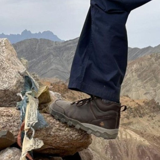 brown barefoot shoes in the mountains background