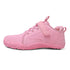 Pink barefoot sneaker for kids with a strap on, side view