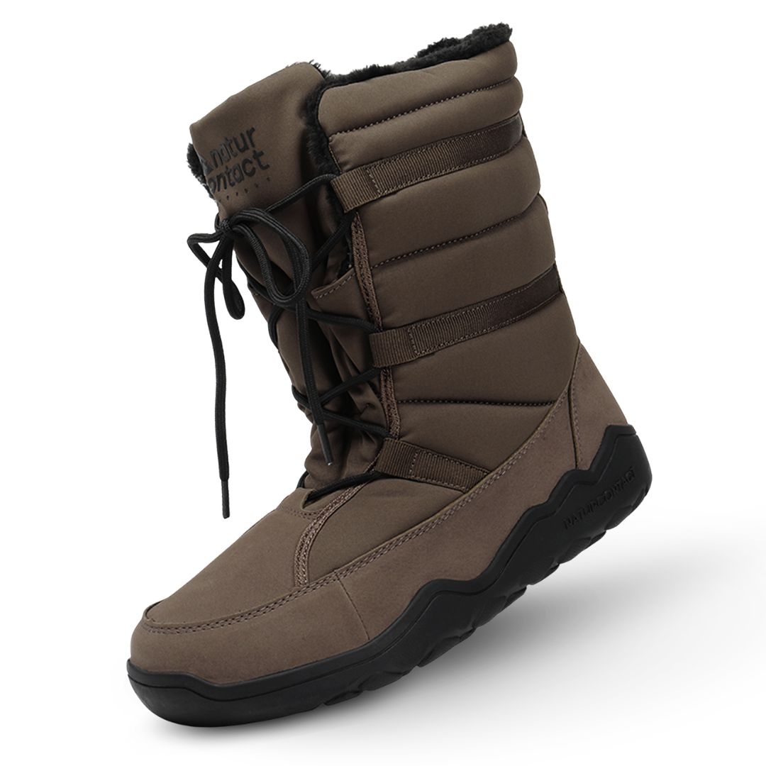 Brown winter boot with black sole on a white background