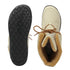 Beige winter boots with brown fur lining and black sole on a white background