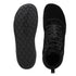 Black high-top sneakers with textured sole on a white background