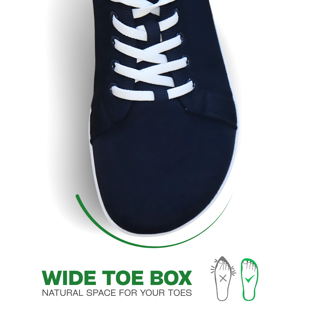 Navy sock with white laces on a light gray background, featuring text about wide toe box.