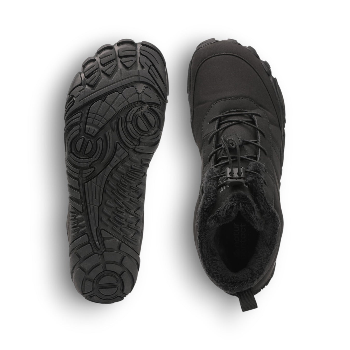 Black boots with detailed sole design on a white background
