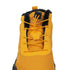 Yellow winter boot with black fur lining on a white background
