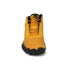 Yellow winter boot with black sole on a white background