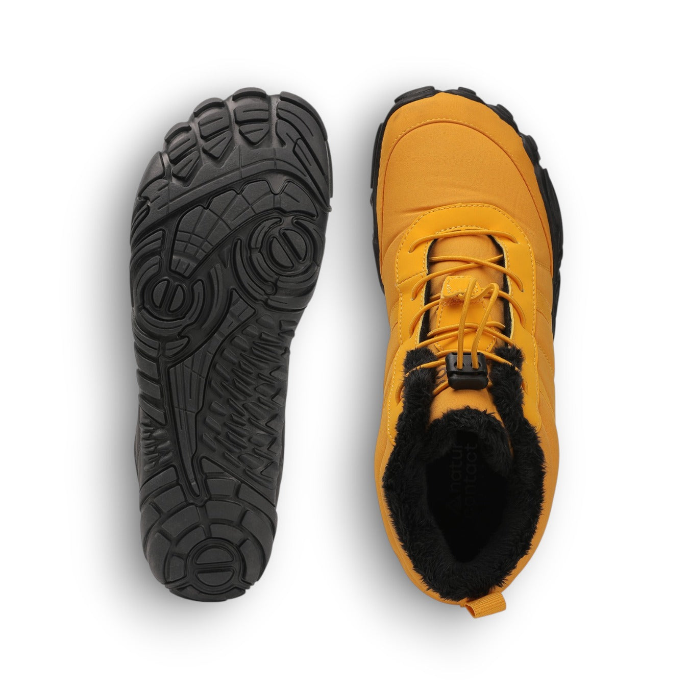 Yellow winter boot with black fur lining and black sole on a white background