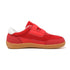 Red children's barefoot shoe with a brown sole on a white background side view