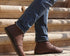 Brown  smart barefoot shoes shoes worn with blue jeans on stone steps