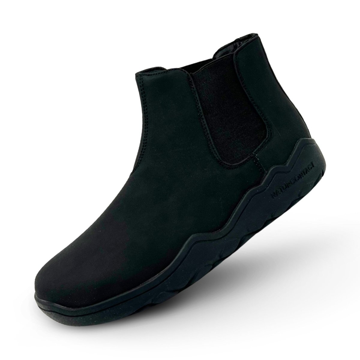 Black Chelsea boot on a white background