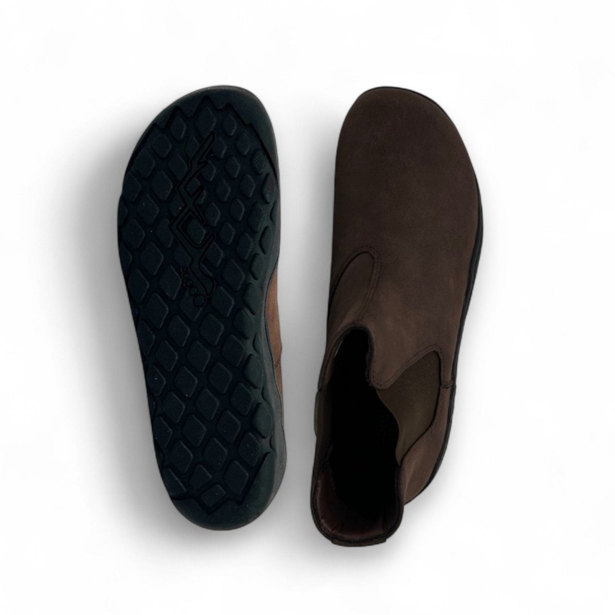 Brown shoe with black sole on a white background