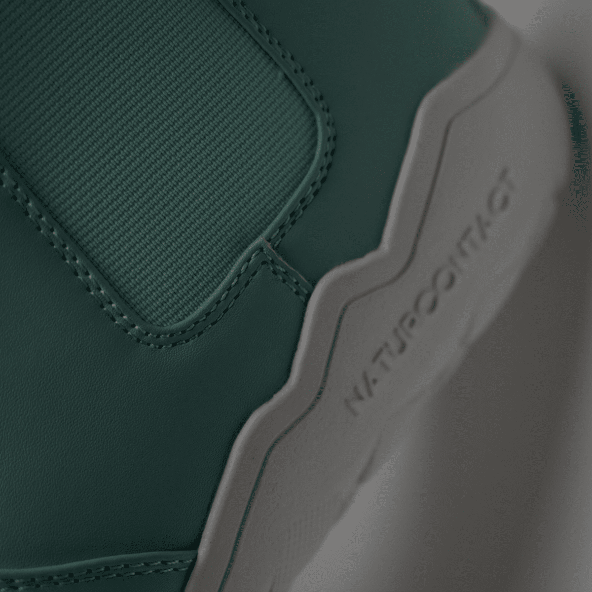 detail of closure and stitching of Light Blue barefoot chelsea boots