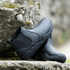 Black chelsea barefoot boots on a rock