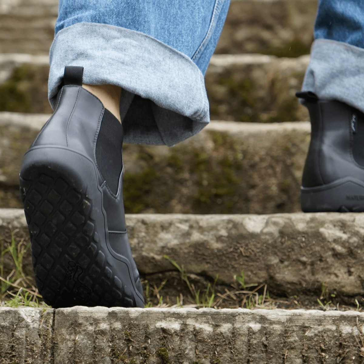 back view with sole detail of Black barefoot chelsea boots
