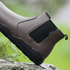 side view of Coffee chelsea barefoot boots on a rock