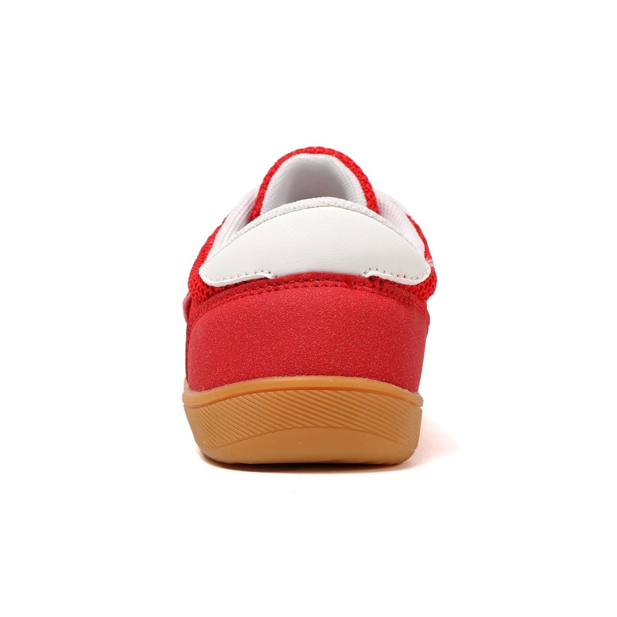 Red barefoot shoe for kids with a brown sole on a white background back view