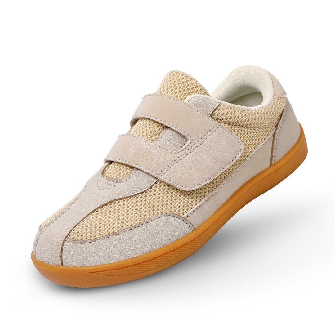 Beige barefoot sneaker for kids with brown sole on a white background