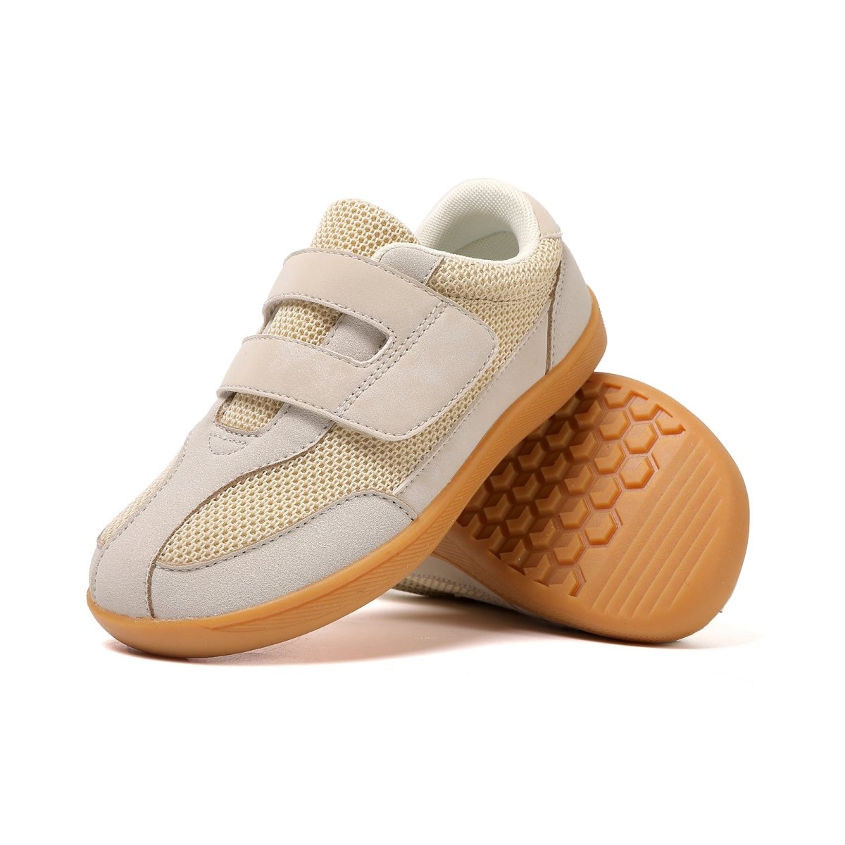 Beige children's barefoot sneakers with brown soles on a white background