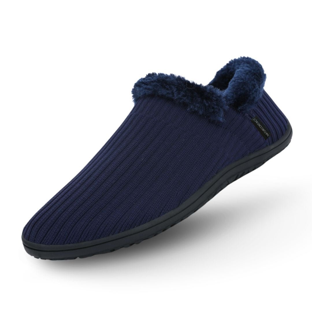 Navy blue barefoot slipper with fuzzy trim on a white background
