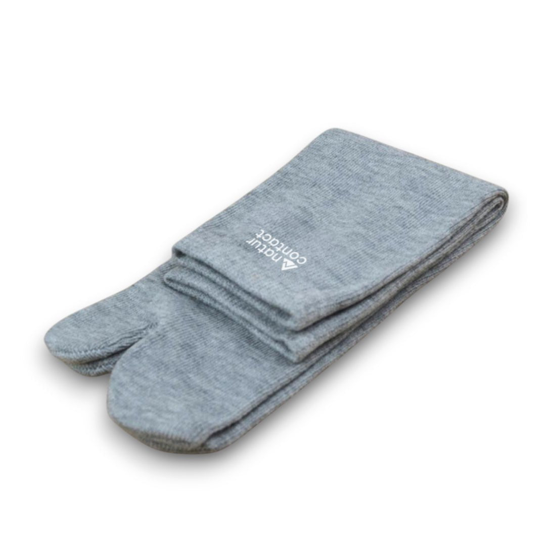Pair of gray tabi socks with a brand logo on a white background