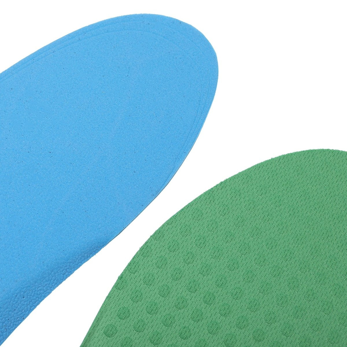 Close-up of soft, flexible insoles in blue and green, showing their cushioning and surface texture.