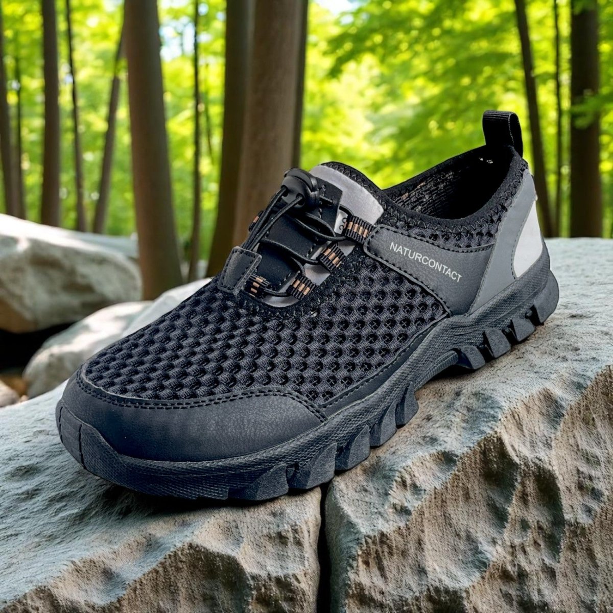 detail of black hiking trekking barefoot shoes in the nature