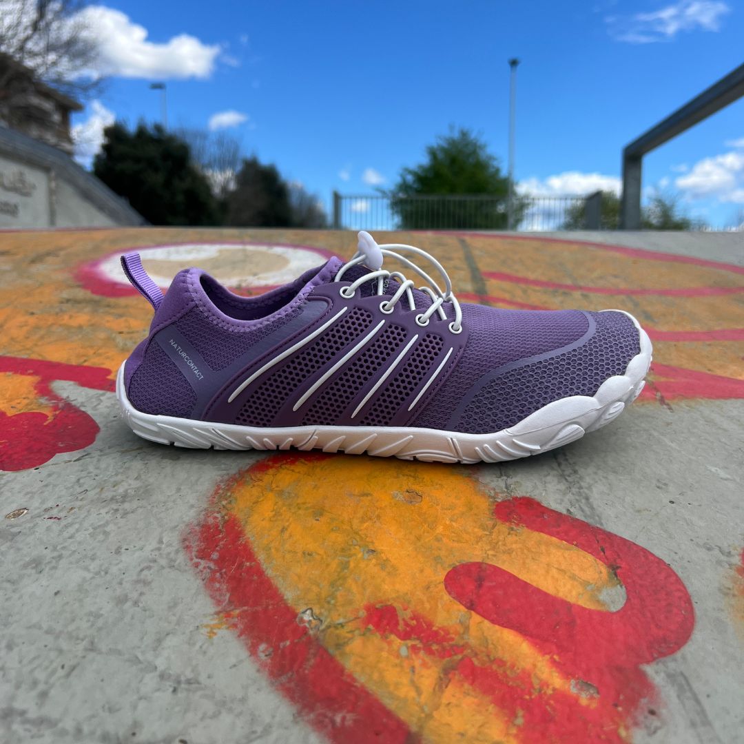 purple lilla side view sport barefoot minimalist shoes on skate track