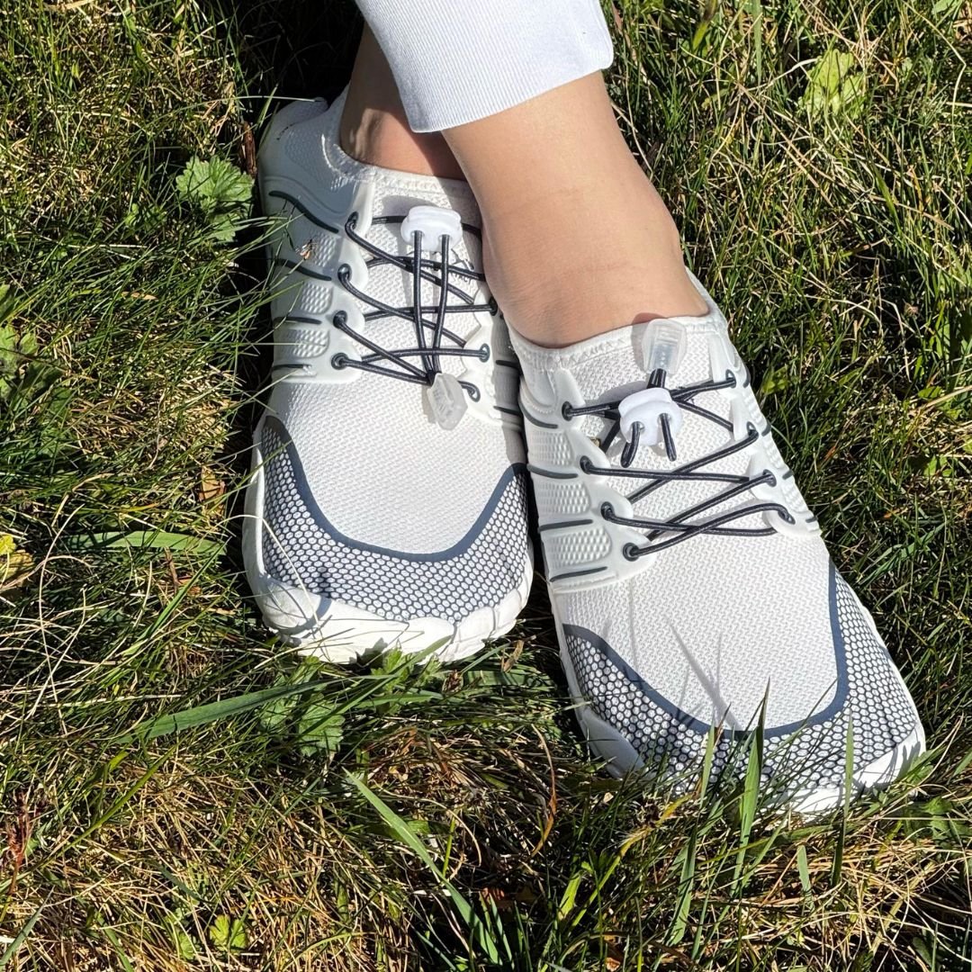 top view sport white blue summer barefoot minimalist shoes on grass