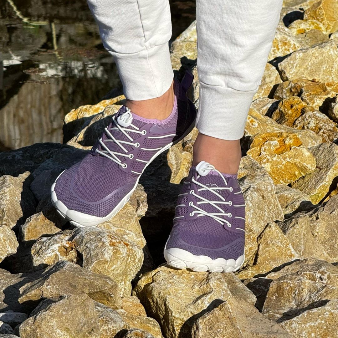 lila purple barefoot shoes summer on rocks